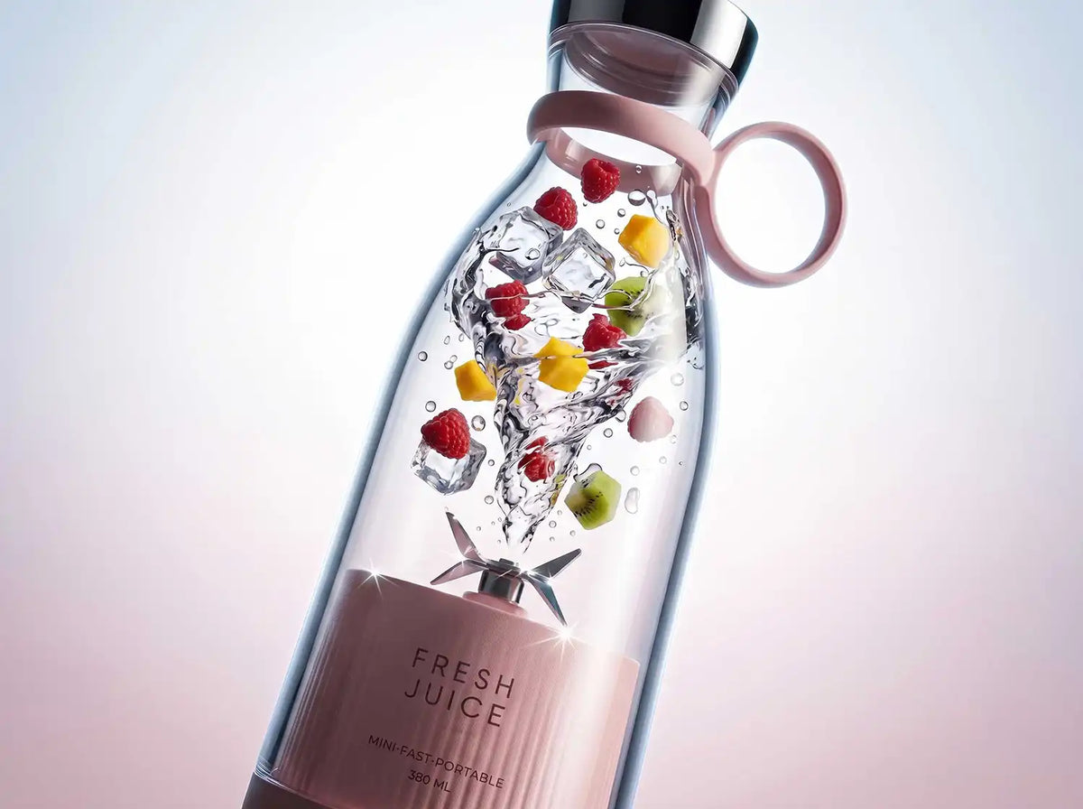 Close-up of a portable mini blender crushing ice and fresh fruit for smoothies